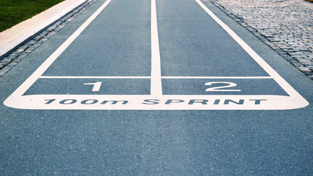 Close-up of outdoor 100m sprint track lanes, perfect for athletics and sprinting events.