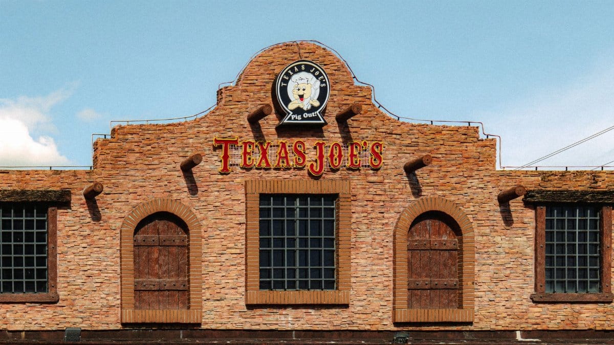 Facade of Texas Joe's BBQ restaurant with rustic brickwork and logo.