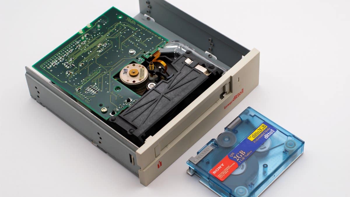 Close-up of an Iomega Ditto drive and a Sony 2GB tape on a white background.
