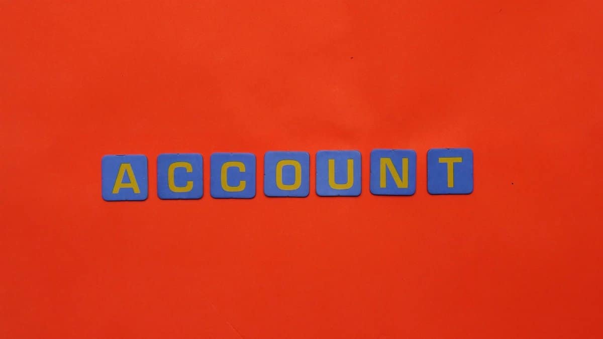 Blue letters spelling ACCOUNT on a vibrant red background, ideal for design and marketing.