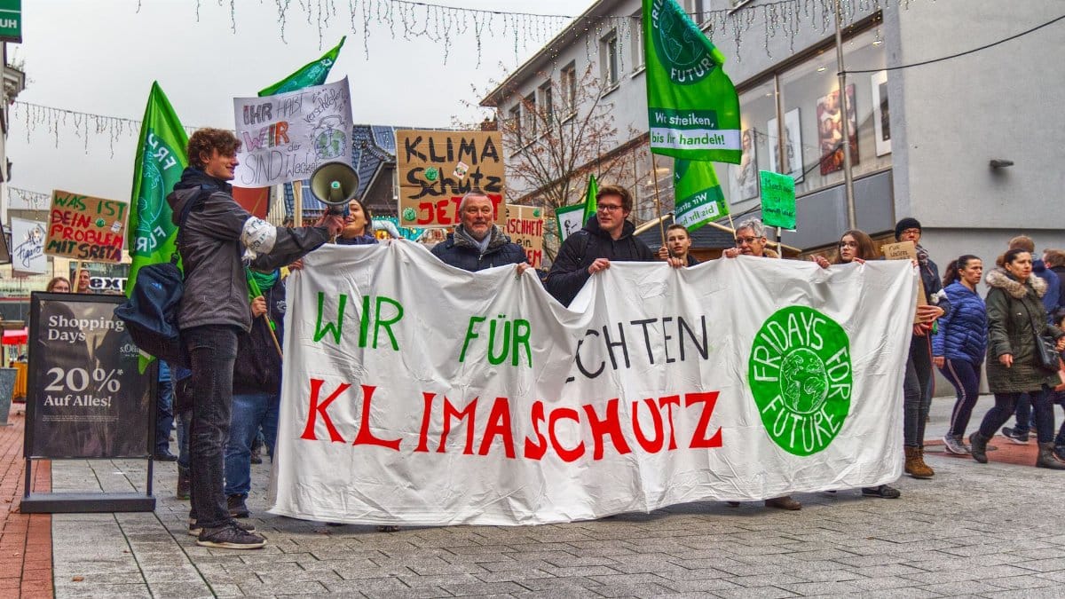 Climate activists march peacefully demanding action on climate change.