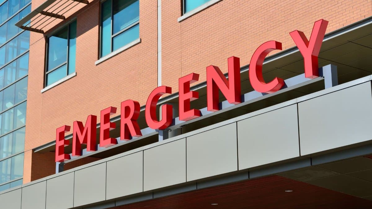 Close-up of a modern hospital emergency room entrance with prominent red letters.