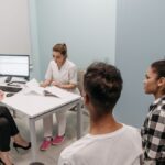 Doctor and patients during a consultation in a modern clinic, teamwork concept.