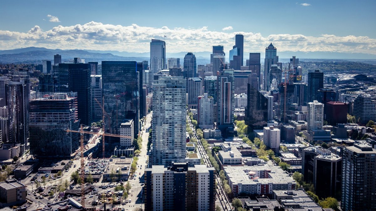 Captivating aerial view of the Seattle skyline, showcasing iconic skyscrapers and urban landscape.