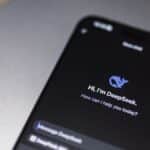 Close-up of smartphone screen showing DeepSeek AI chatbot interface on a modern device.