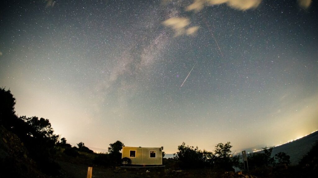 A breathtaking view of a meteor shower and starry night sky in Ohrid, North Macedonia.