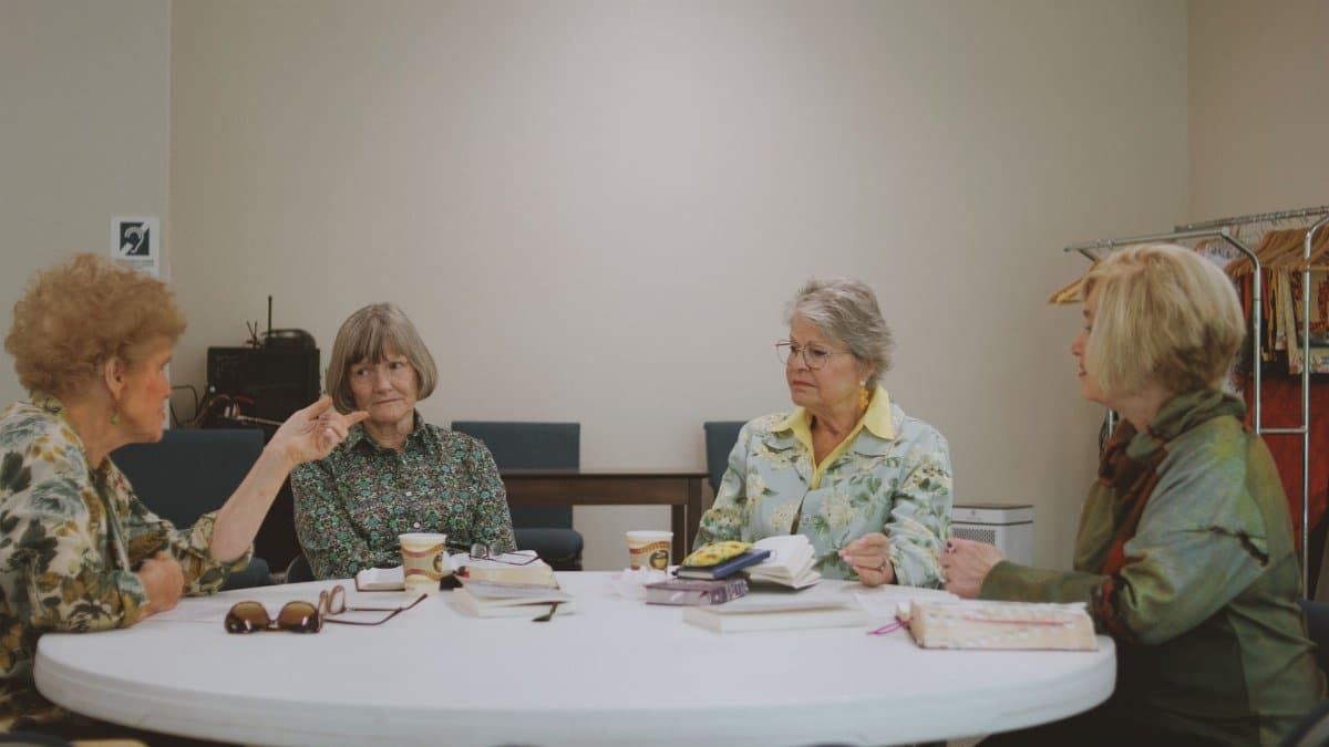 Senior women engage in a Bible study session at a community church in Brevard.