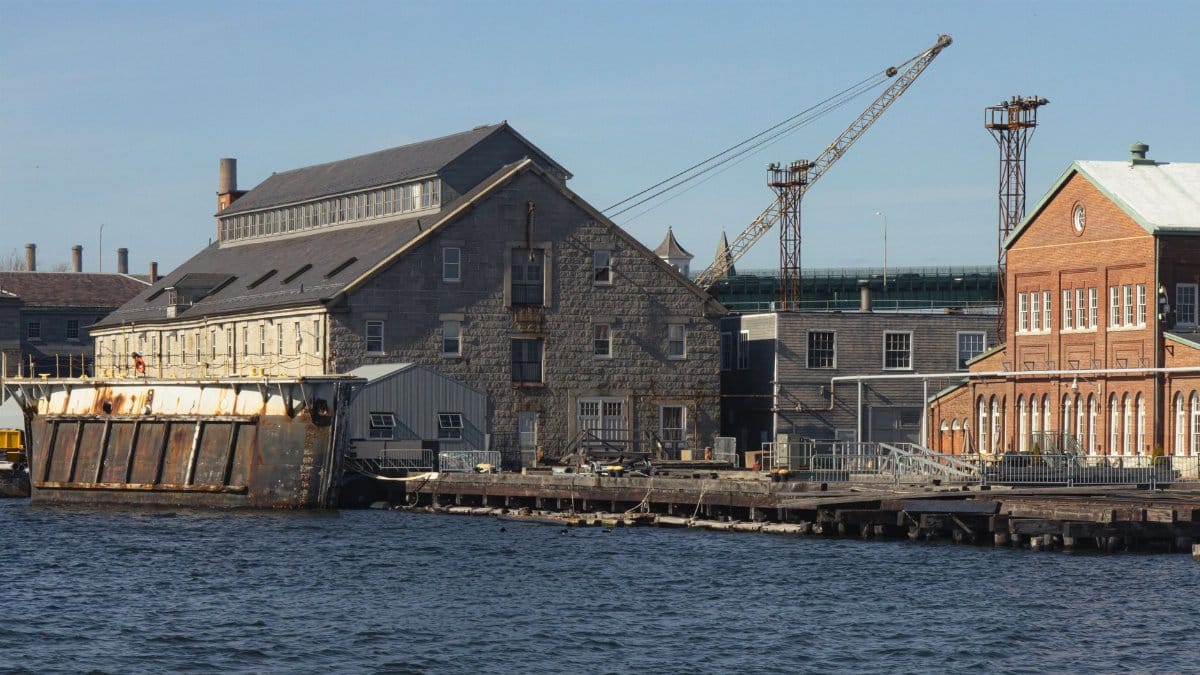 Explore the historic Boston Navy Yard with its iconic waterfront architecture and shipyard scenery.