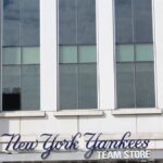 Close-up of the New York Yankees Team Store facade, featuring modern architecture.