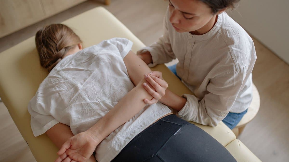 A woman receiving chiropractic treatment on a massage table for relaxation and health.