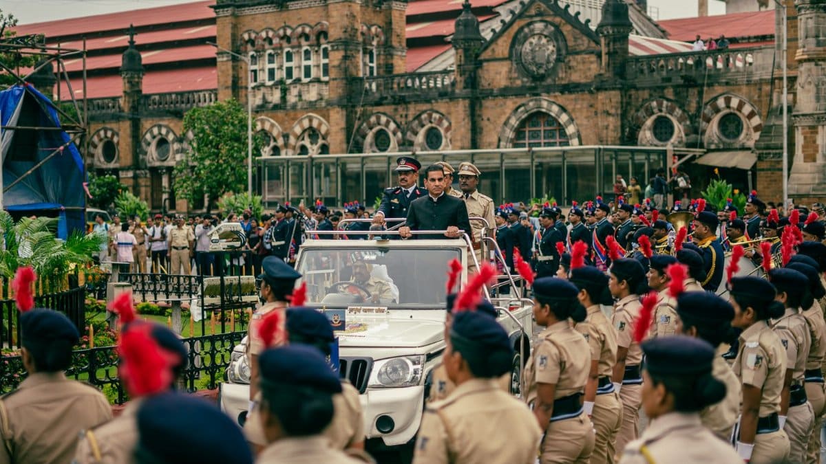 Vibrant parade with police officers celebrating Independence Day in Mumbai, India, near Chhatrapati Shivaji Terminus.