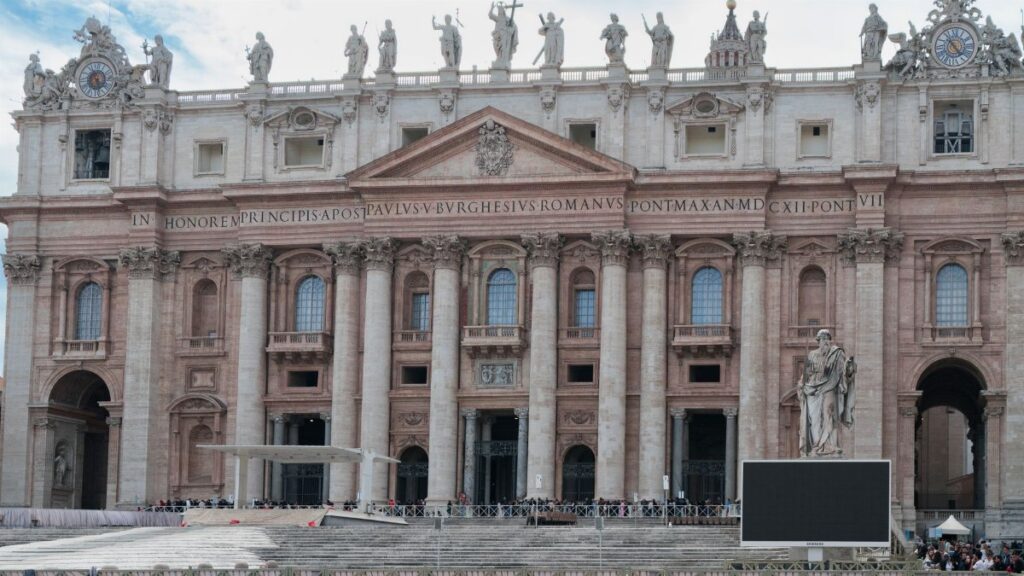 Detailed view of the iconic St Peter's Basilica front in Vatican City, highlighting its architectural grandeur.