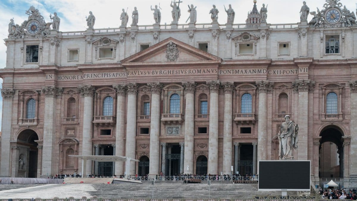 Detailed view of the iconic St Peter's Basilica front in Vatican City, highlighting its architectural grandeur.