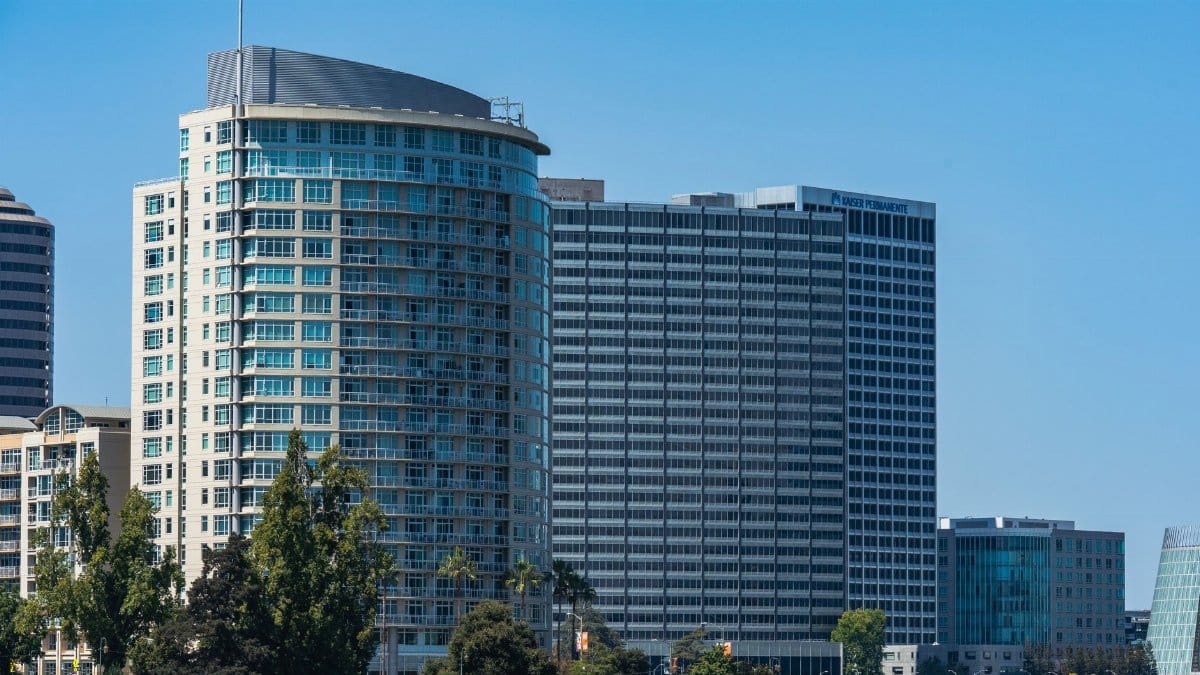 Contemporary architecture in Oakland's skyline on a clear day.