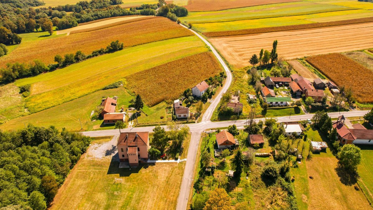Aerial view of the picturesque Garešnica countryside showcasing roads, fields, and rural homes.