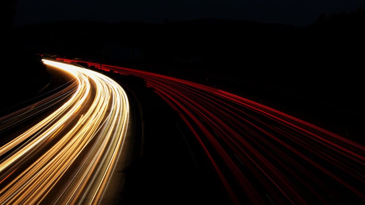 Long exposure of highway lights creating beautiful trails at night.