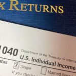 Close-up image of Form 1040 for U.S. tax returns, highlighting filing status options.