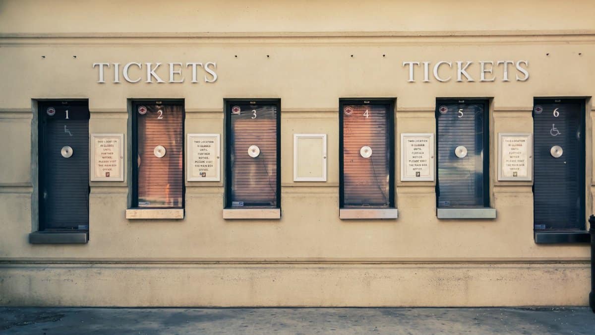 Row of closed ticket booths in Baltimore city center, showcasing urban architecture.