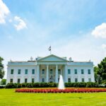 The iconic White House lawn and fountain on a bright summer day in Washington, DC.