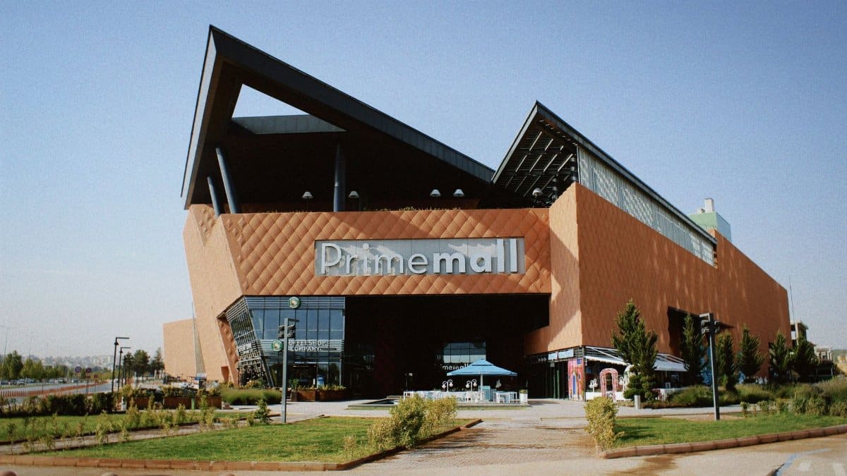 Prime Mall exterior with striking architecture on a clear day.