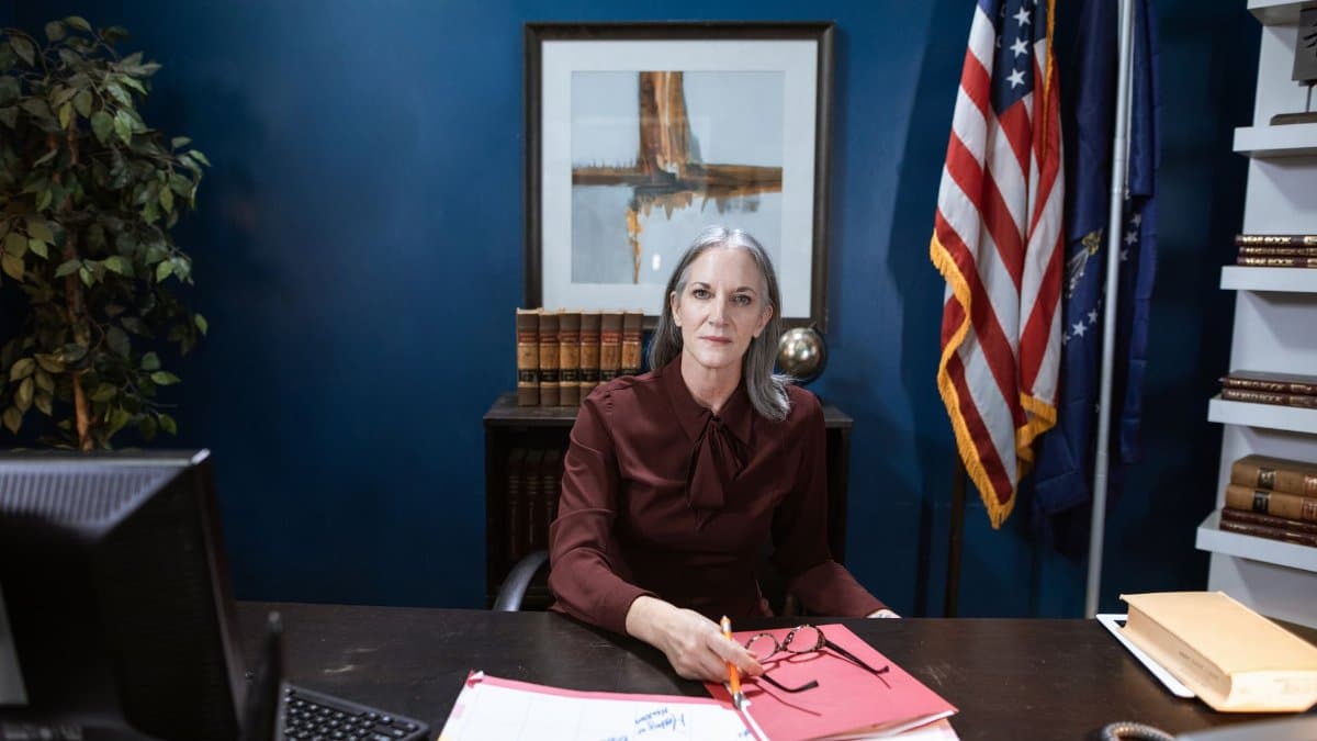 Professional woman in an office representing leadership and authority.