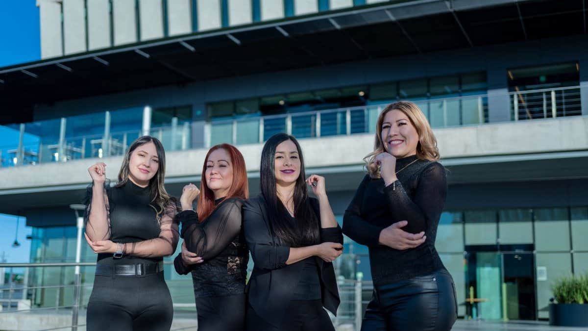 Group of confident women leaders posing outdoors in Juárez, Mexico, showcasing empowerment.