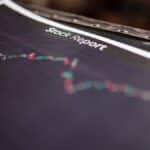 Detailed stock report showing market trends on paper charts.