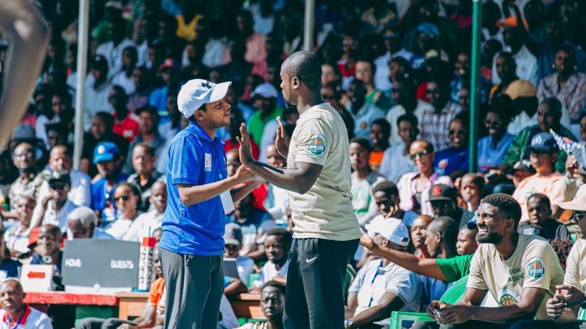 Exciting crowd at a sports event with engaging interactions among attendees.