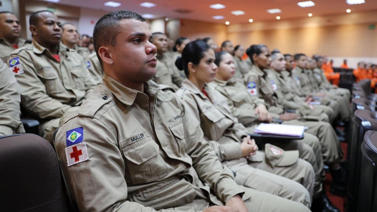 Brazilian firefighters attentively participate in a strategic training session.