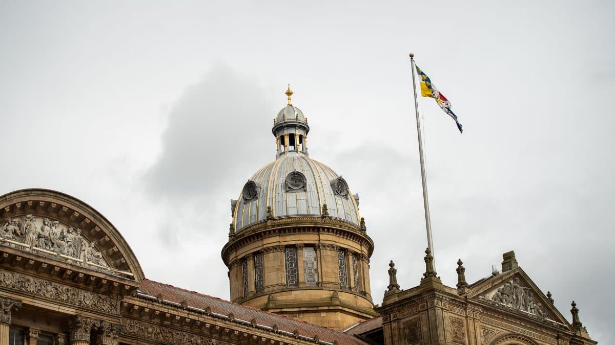 The historic architecture of Birmingham Council House with its iconic dome and flag.