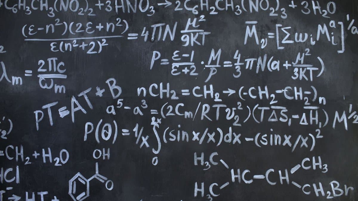 Intricate mathematical and chemical equations chalked on a blackboard symbolizing education and science.