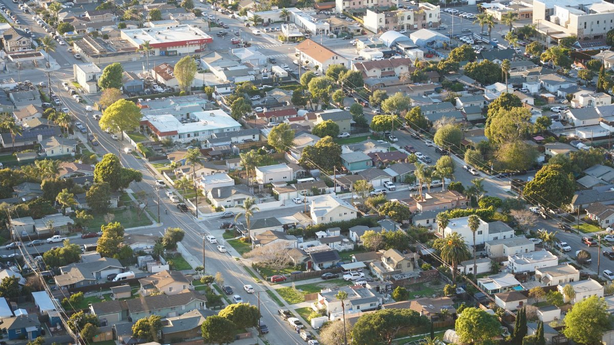 Overhead shot of a suburban neighborhood in Ventura, showcasing homes and streets.