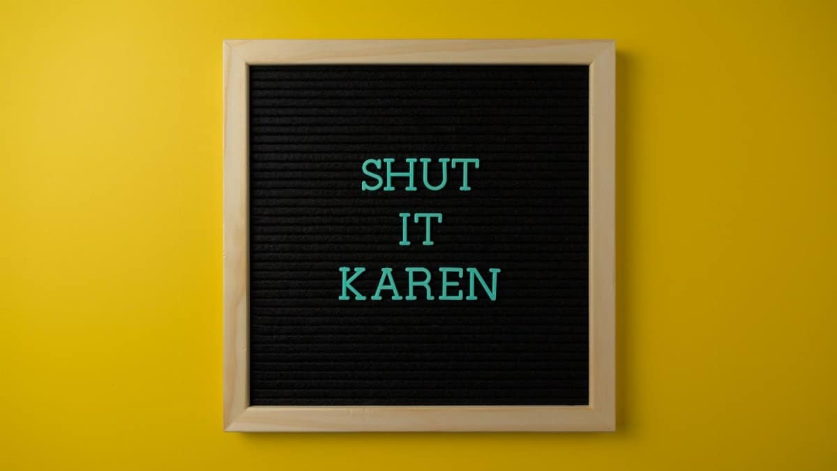Square letter board with 'Shut it Karen' text on vivid yellow background.