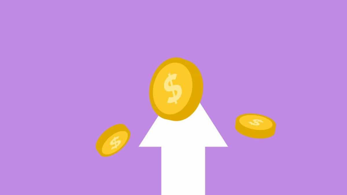 Decorative cardboard appliques of arrow and dollar coins representing income concept on violet background