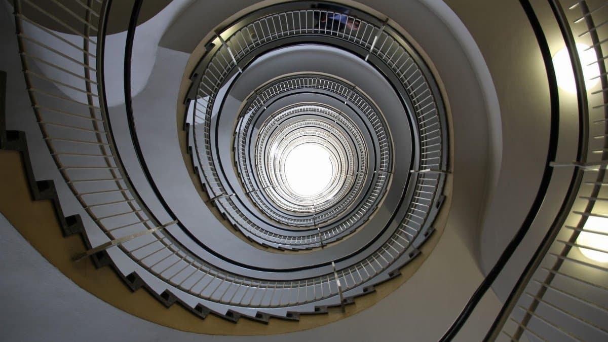 A stunning view of a modern spiral staircase showcasing geometric elegance and architectural beauty.