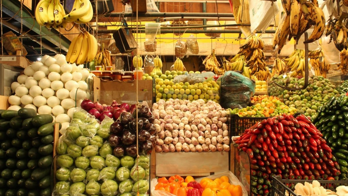 Vibrant display of fruits and vegetables in San Pedro Cholula market, Puebla, México.