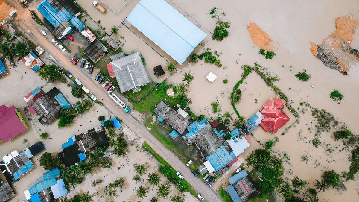 Aerial shot of a flooded town in Kijal, Terengganu, Malaysia, highlighting water damage.