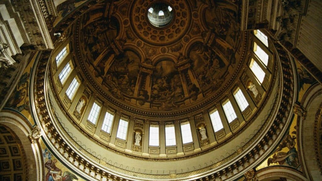 Intricate interior view of St. Paul's Cathedral dome in London, showcasing stunning architectural details.