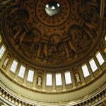 Intricate interior view of St. Paul's Cathedral dome in London, showcasing stunning architectural details.