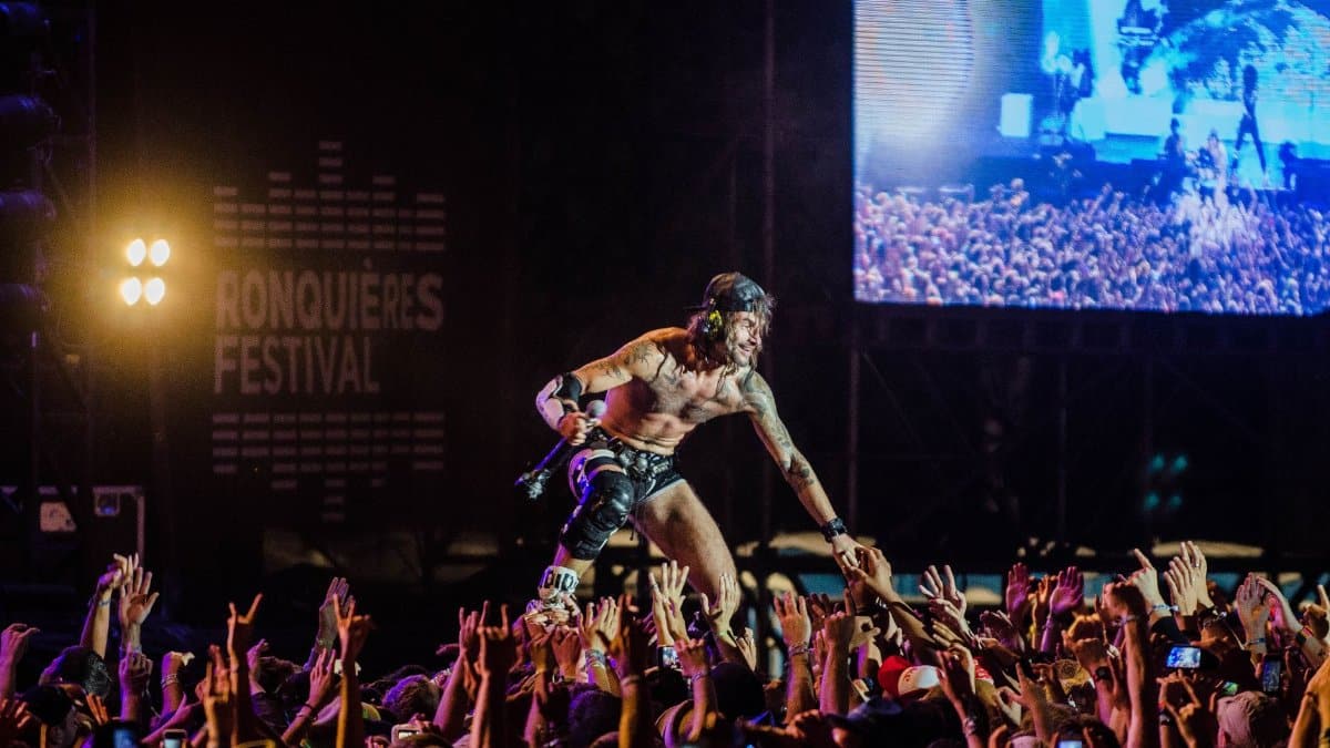 Dynamic live performance at Ronquières Festival capturing the energy of the crowd and musician.