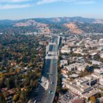 Aerial view capturing the sprawling suburbs and highway of Walnut Creek, California