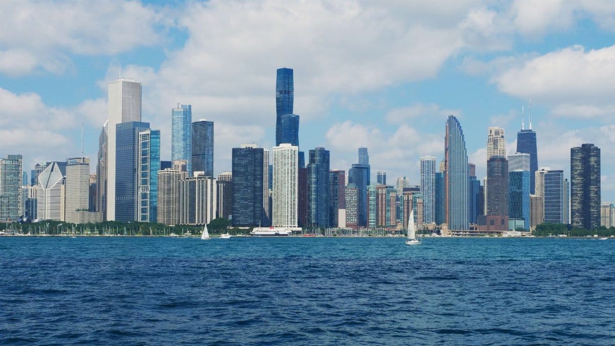 A breathtaking view of Chicago's iconic skyline across Lake Michigan on a clear day.