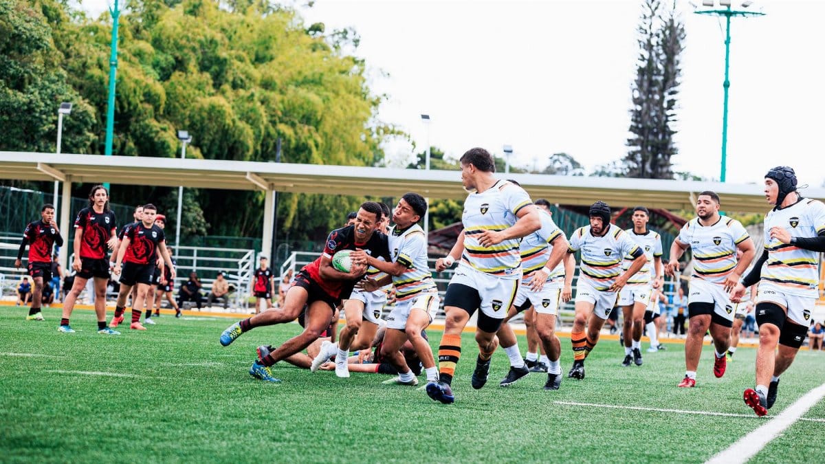 Rugby players in action, capturing the intensity of a match on an outdoor field.