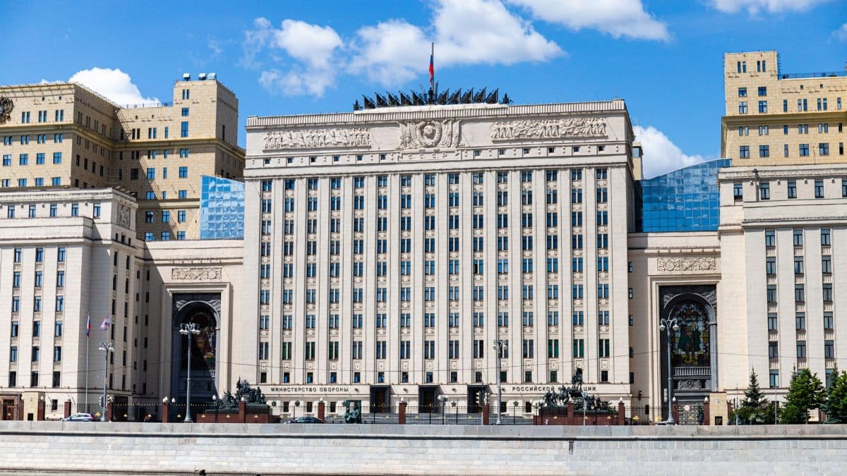 Facade of the Russian Ministry building in Moscow along the river under a clear sky.