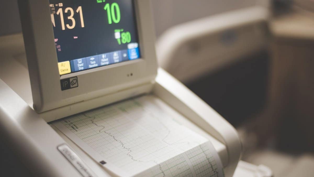 Close-up shot of a medical ECG monitor displaying heart rate and oxygen levels, essential for patient monitoring.