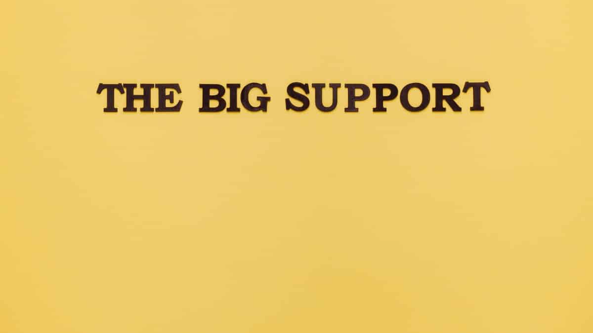 Conceptual image with black text 'The Big Support' on a yellow background, ideal for design projects.