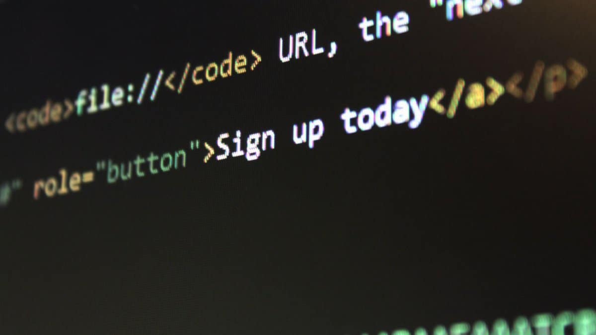 Detailed view of HTML and CSS code on a computer screen, concept of programming.