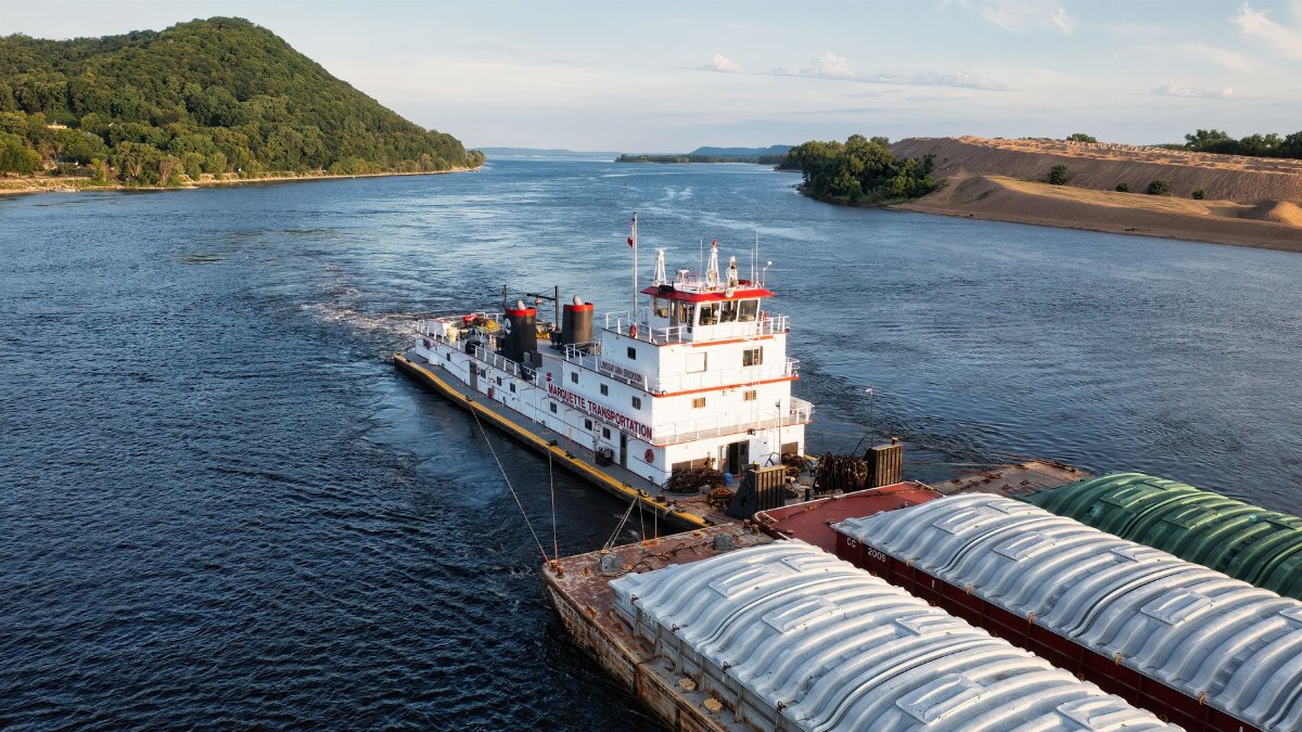 Aerial view of a barge and tugboat on Mississippi River in Reads Landing, MN.