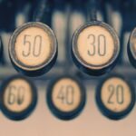 Close-up of a vintage typewriter showcasing numbered keys with a retro feel.