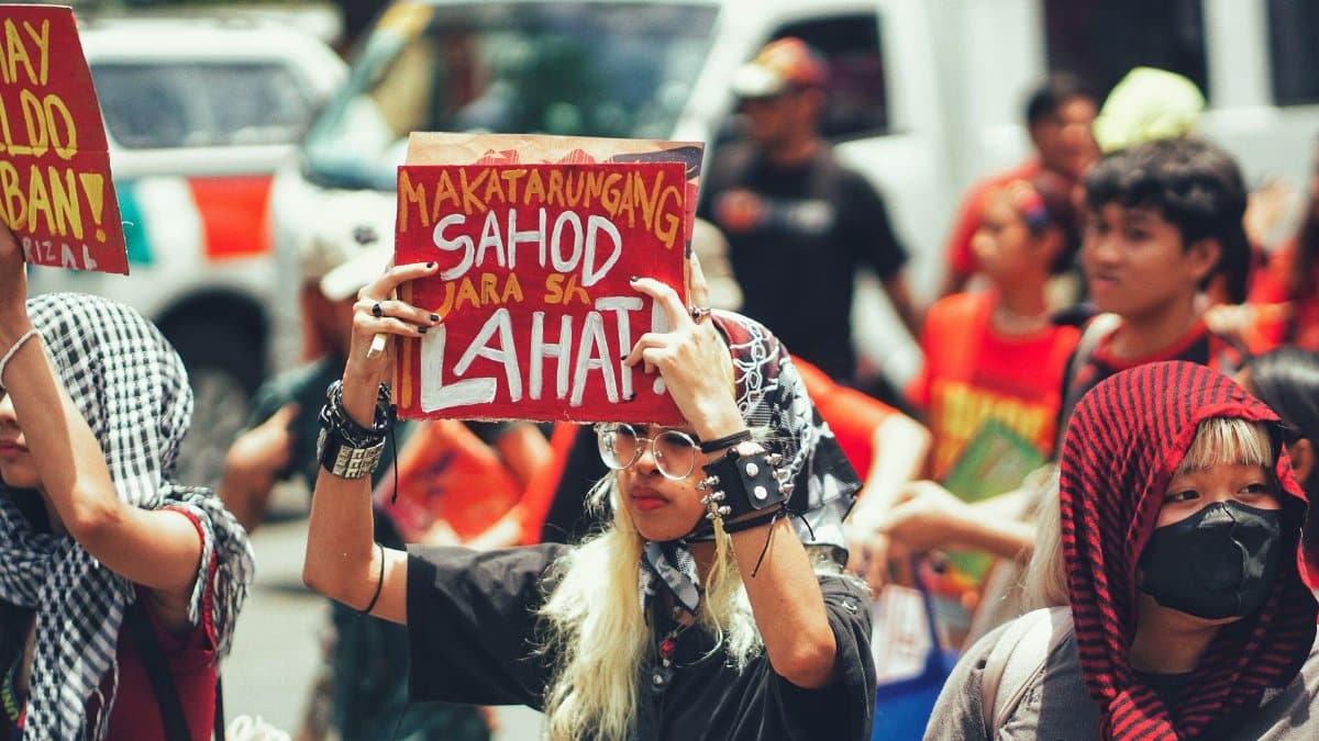 A lively protest scene with passionate individuals holding signs advocating for fair wages.